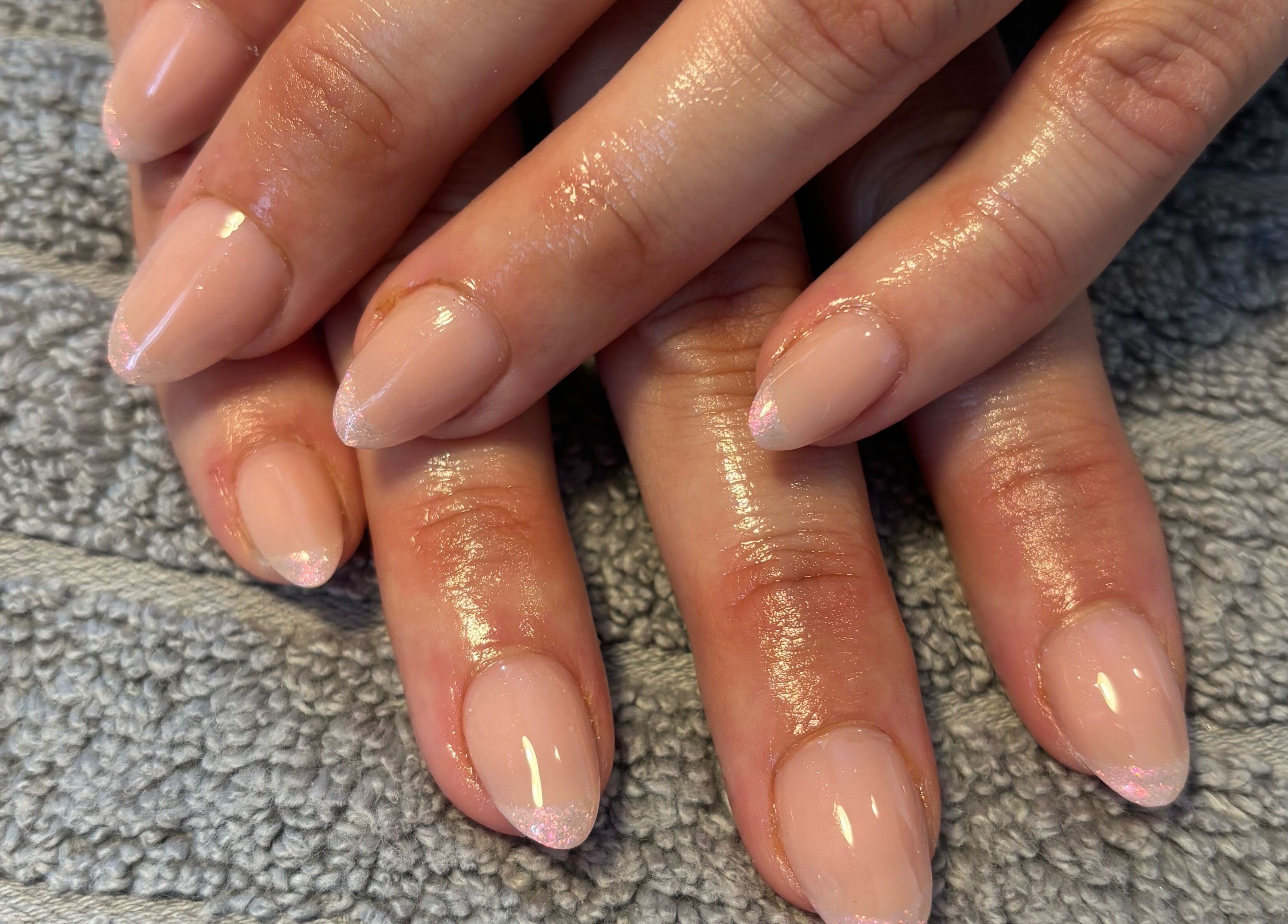 Manicured nails with a glossy finish at Nailsbyebonyy, Rainham, England, GB.