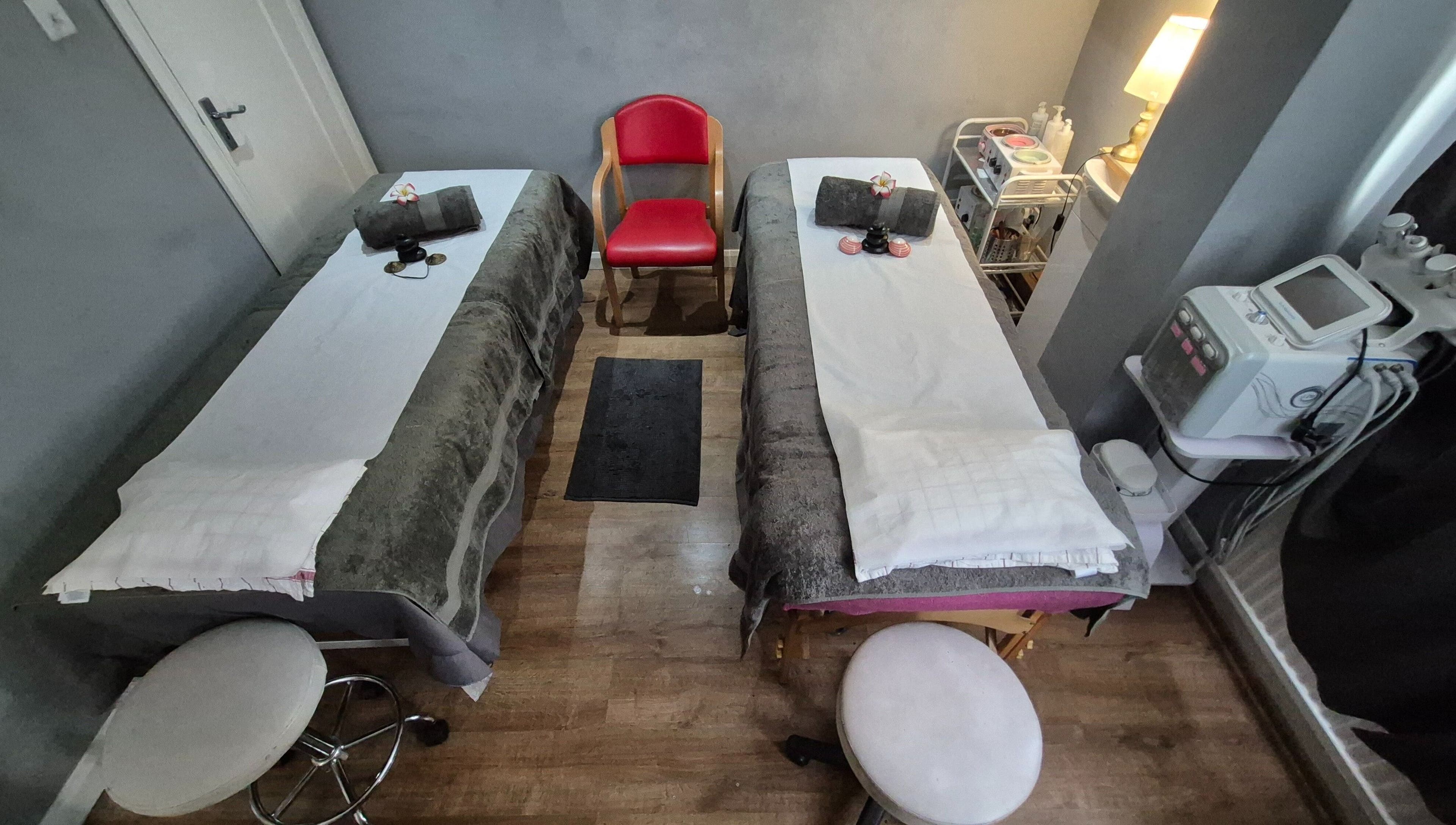 Cozy massage beds at Victoria Beauty Salon in London, England, GB, set for a luxury spa session.