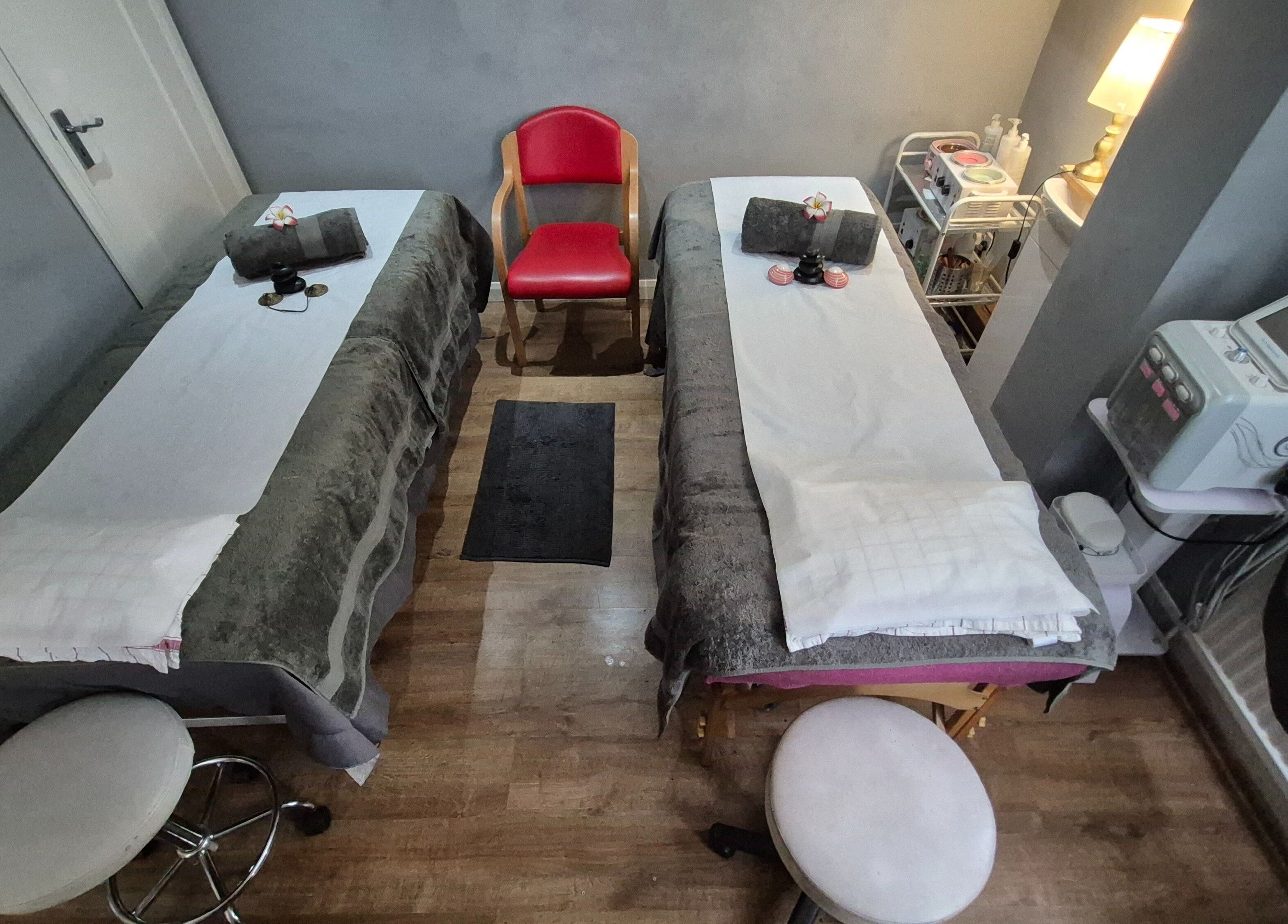 Cozy massage beds at Victoria Beauty Salon in London, England, GB, set for a luxury spa session.