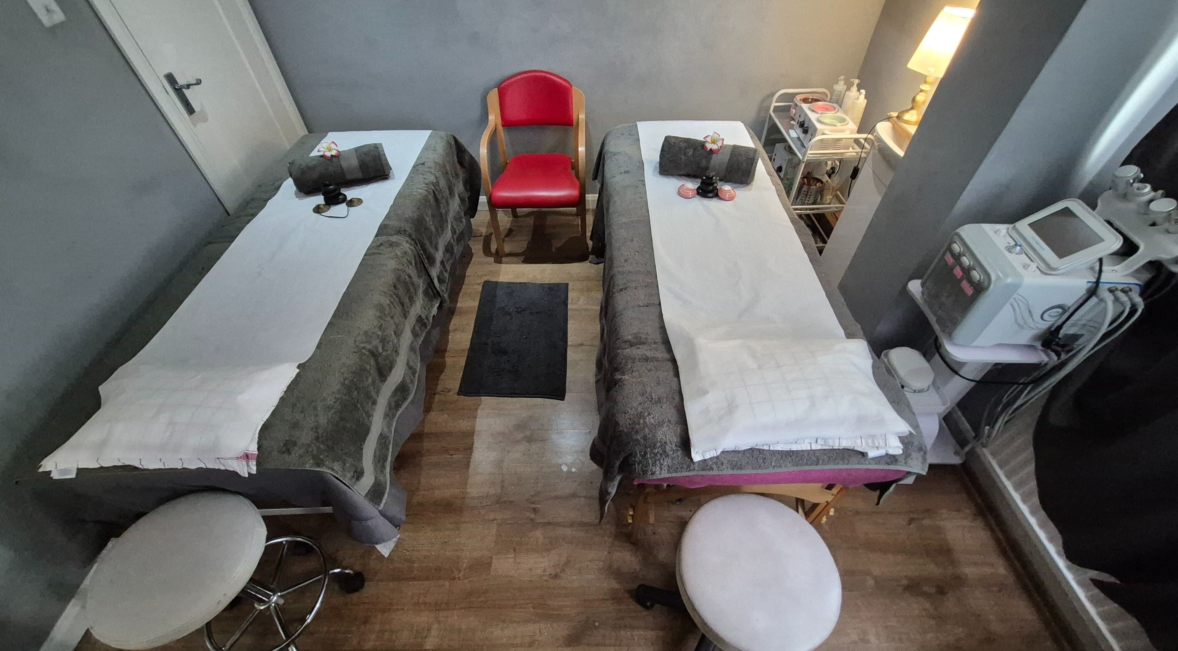 Cozy massage beds at Victoria Beauty Salon in London, England, GB, set for a luxury spa session.