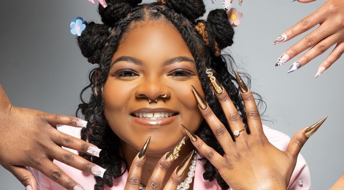 Diverse nail designs displayed at Nat Thee Nailtech in Pensacola, Florida, US showcasing creativity.