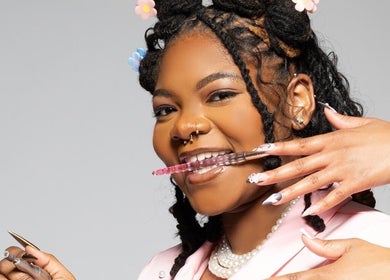 Creative nail technician at Nat Thee Nailtech showcasing intricate designs in Pensacola, Florida, US.