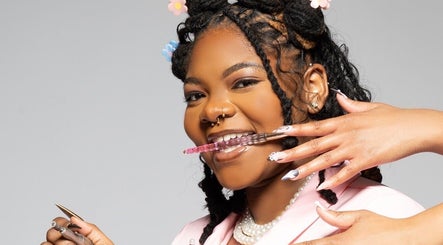 Creative nail technician at Nat Thee Nailtech showcasing intricate designs in Pensacola, Florida, US.