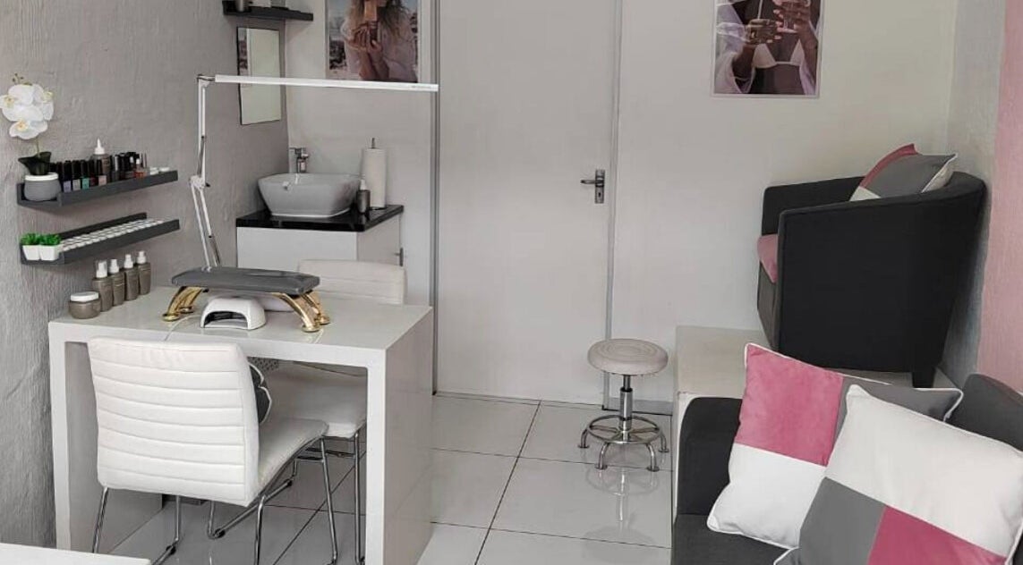 Modern and chic beauty service area at 12TWELVE, Pretoria, Gauteng, ZA with elegant decor and nail care setup.