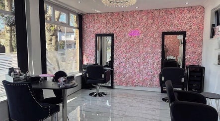 Elegant salon chairs and floral wall at Divine Touch, Wolverhampton, England, GB offering a luxurious beauty experience.