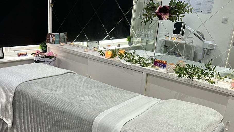 Tranquil treatment room at Divine Touch, Wolverhampton, England, GB, featuring elegant décor and ambient lighting.
