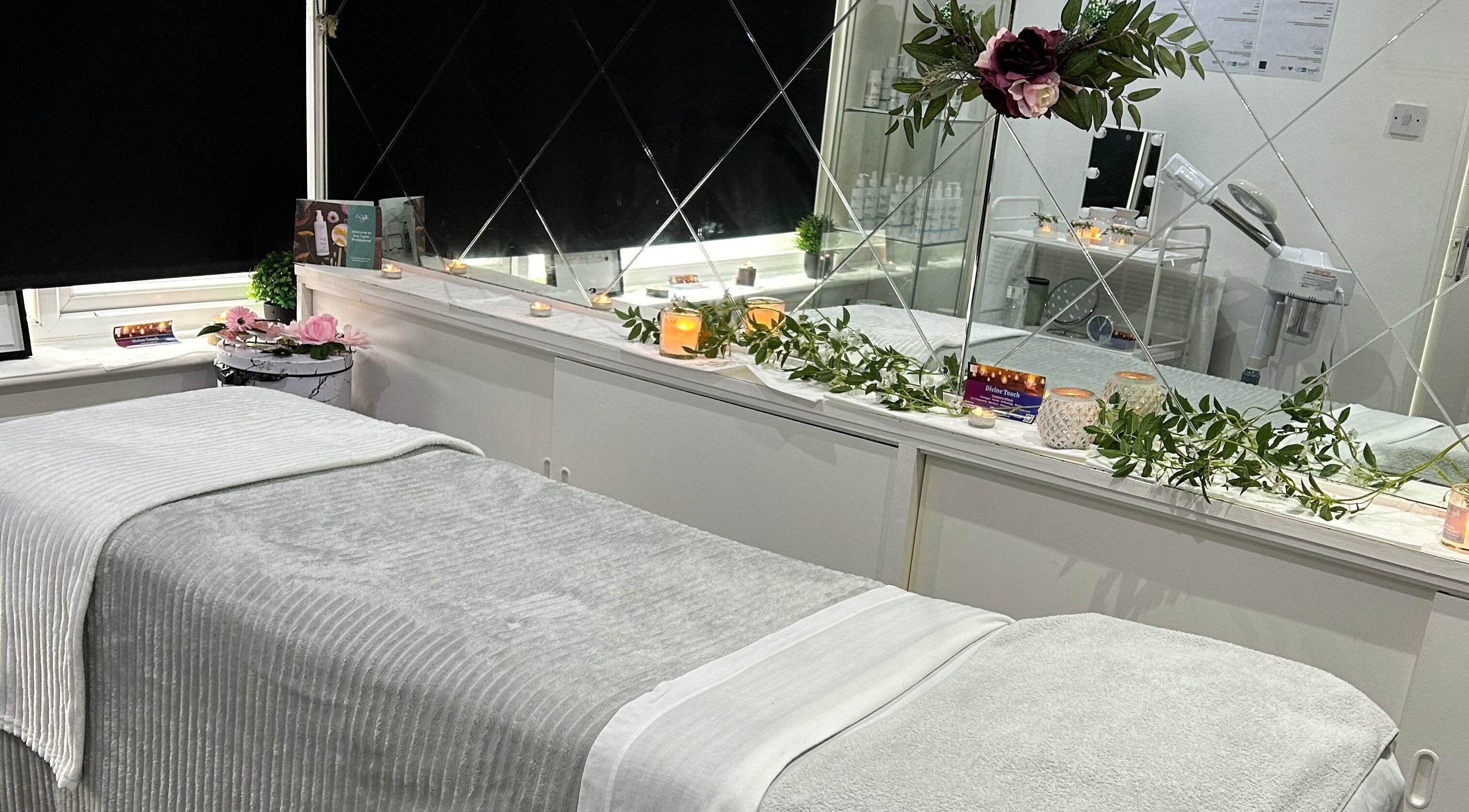 Tranquil treatment room at Divine Touch, Wolverhampton, England, GB, featuring elegant décor and ambient lighting.