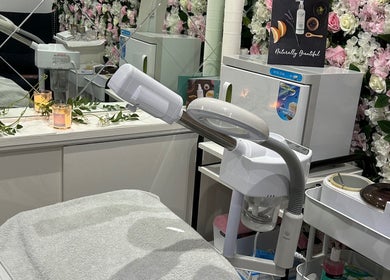 Elegant skincare setup at Divine Touch, Wolverhampton, England, GB with modern equipment and floral decor.