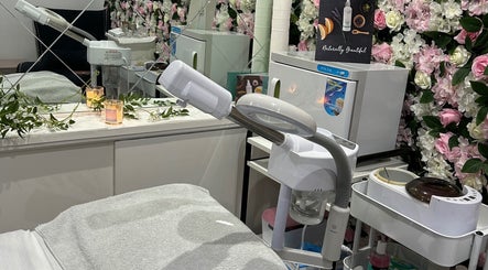 Elegant skincare setup at Divine Touch, Wolverhampton, England, GB with modern equipment and floral decor.