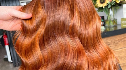 Vibrant auburn hair styling at Blended Hair Collective, Harrogate, England, GB, highlighting glossy waves.