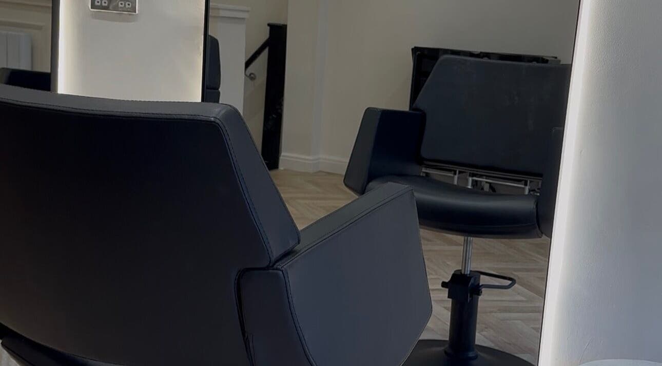 Modern salon chairs at Blended Hair Collective in Harrogate, England, GB. Sleek and inviting interior design.