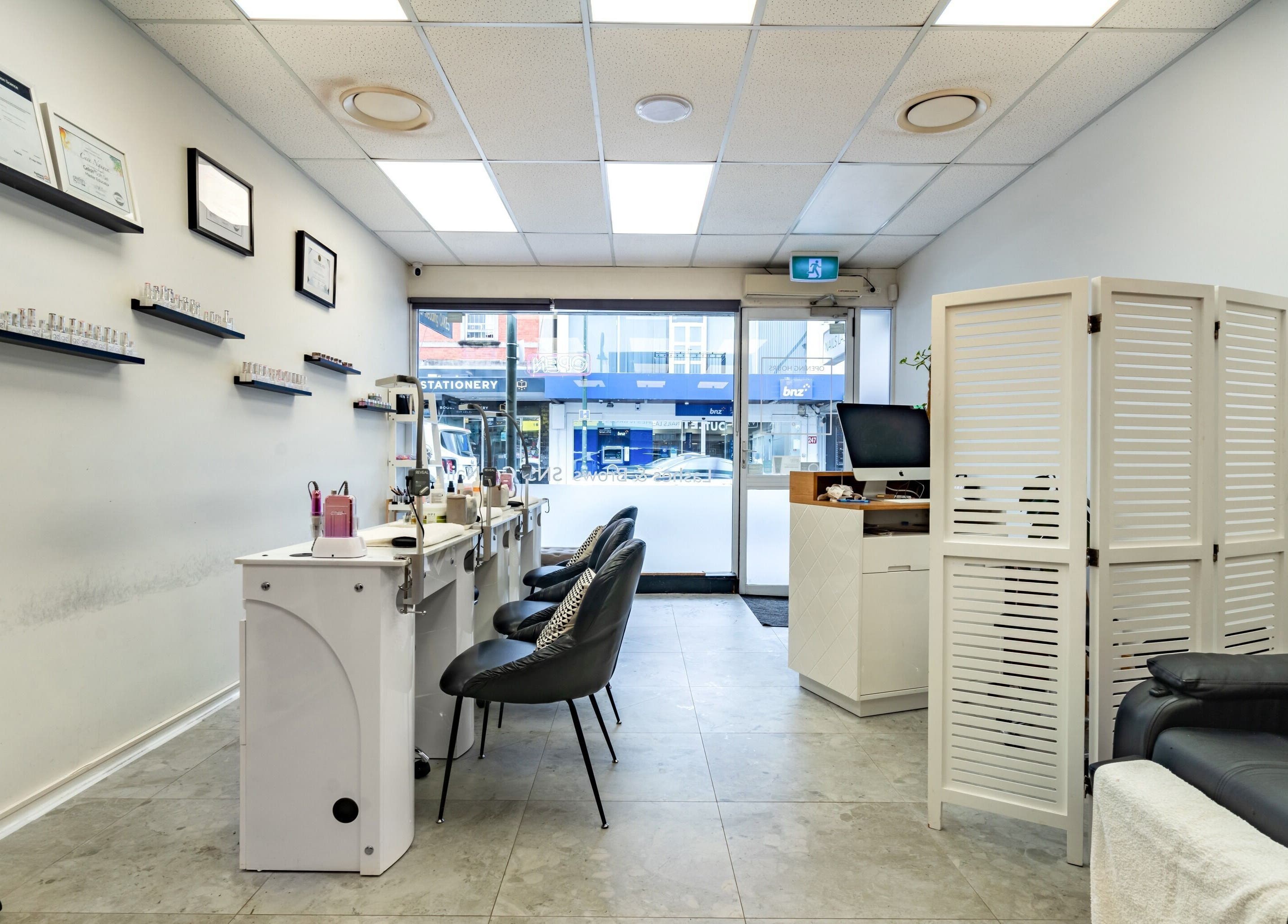 Modern nail salon interior at Flutter & Co, Auckland, Auckland, NZ, featuring sleek decor and comfortable seating.