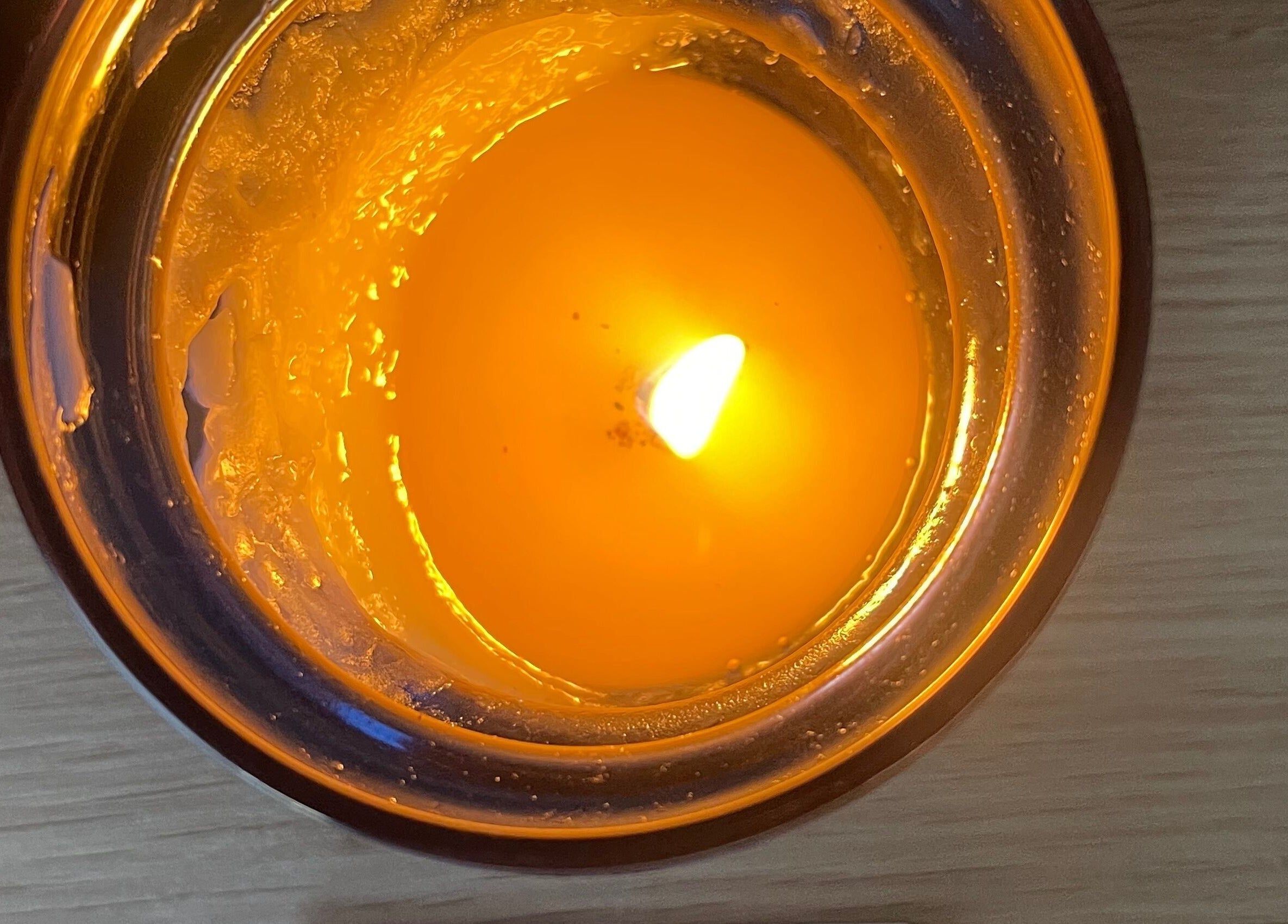 Warm amber candle light at The Body Lab in Richmond, Tasman Region, NZ, creating a soothing atmosphere.