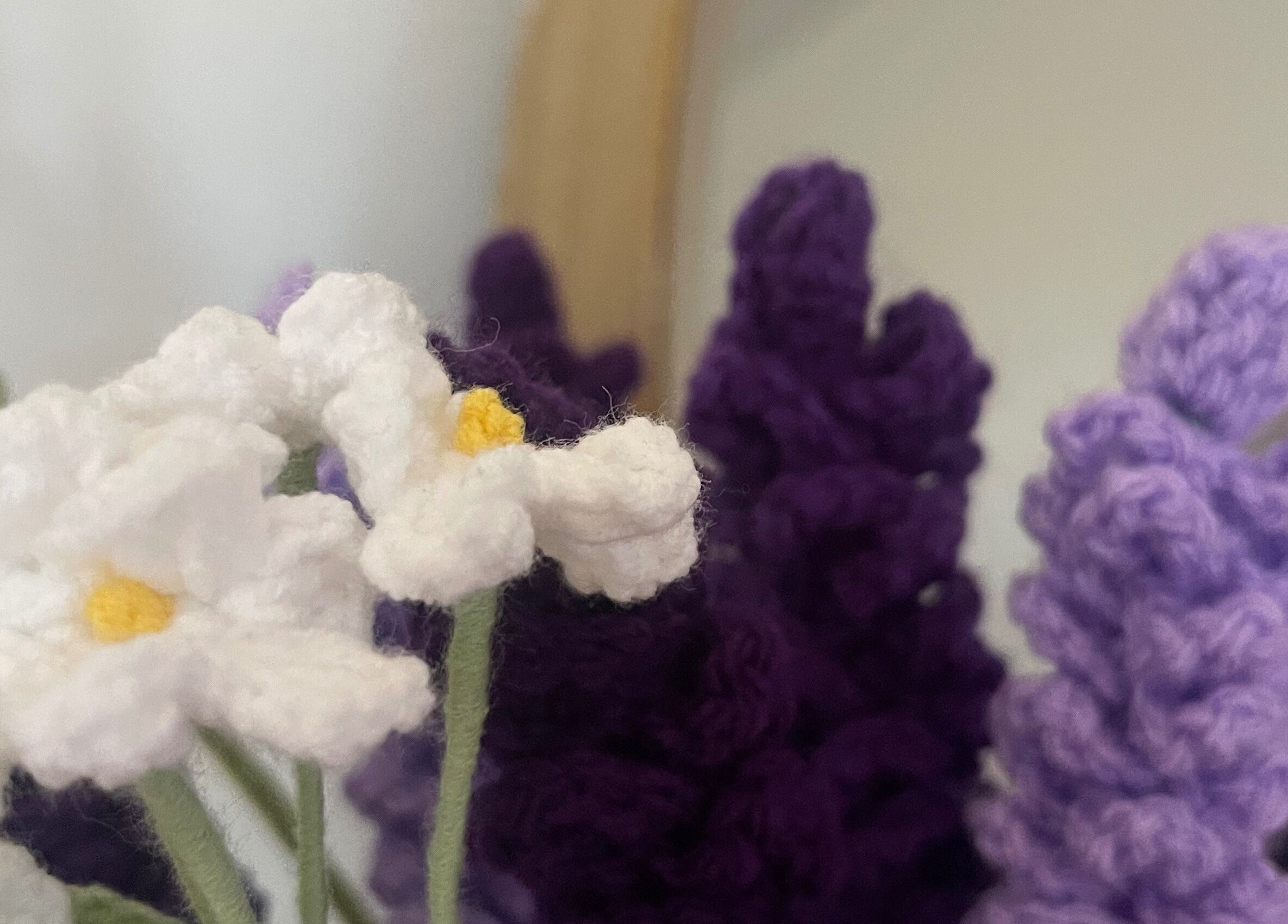 Close-up of knitted flowers at The Body Lab, Richmond, Tasman Region, NZ, creating a cozy and inviting ambiance.