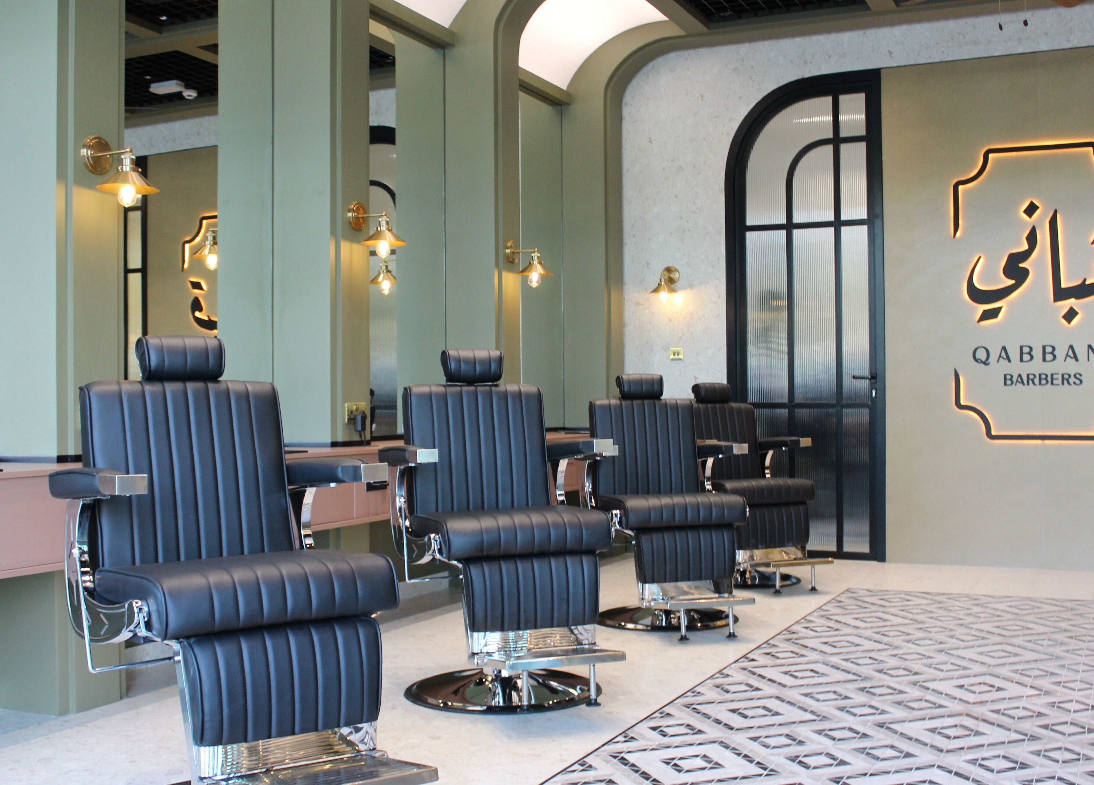 Elegant interior of Qabbani Barbers in Dubai, Dubai, AE featuring modern barber chairs and stylish design.