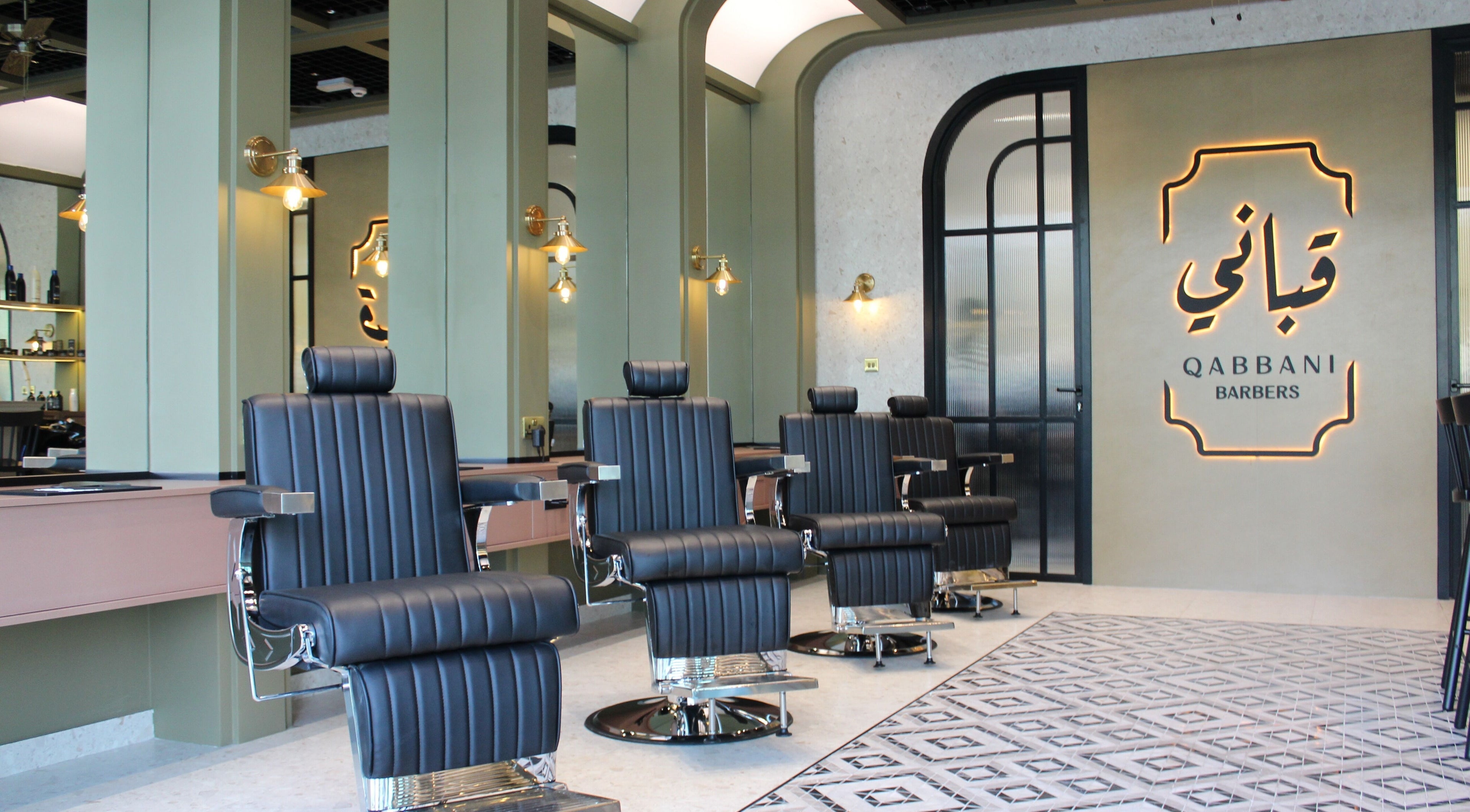 Elegant interior of Qabbani Barbers in Dubai, Dubai, AE featuring modern barber chairs and stylish design.