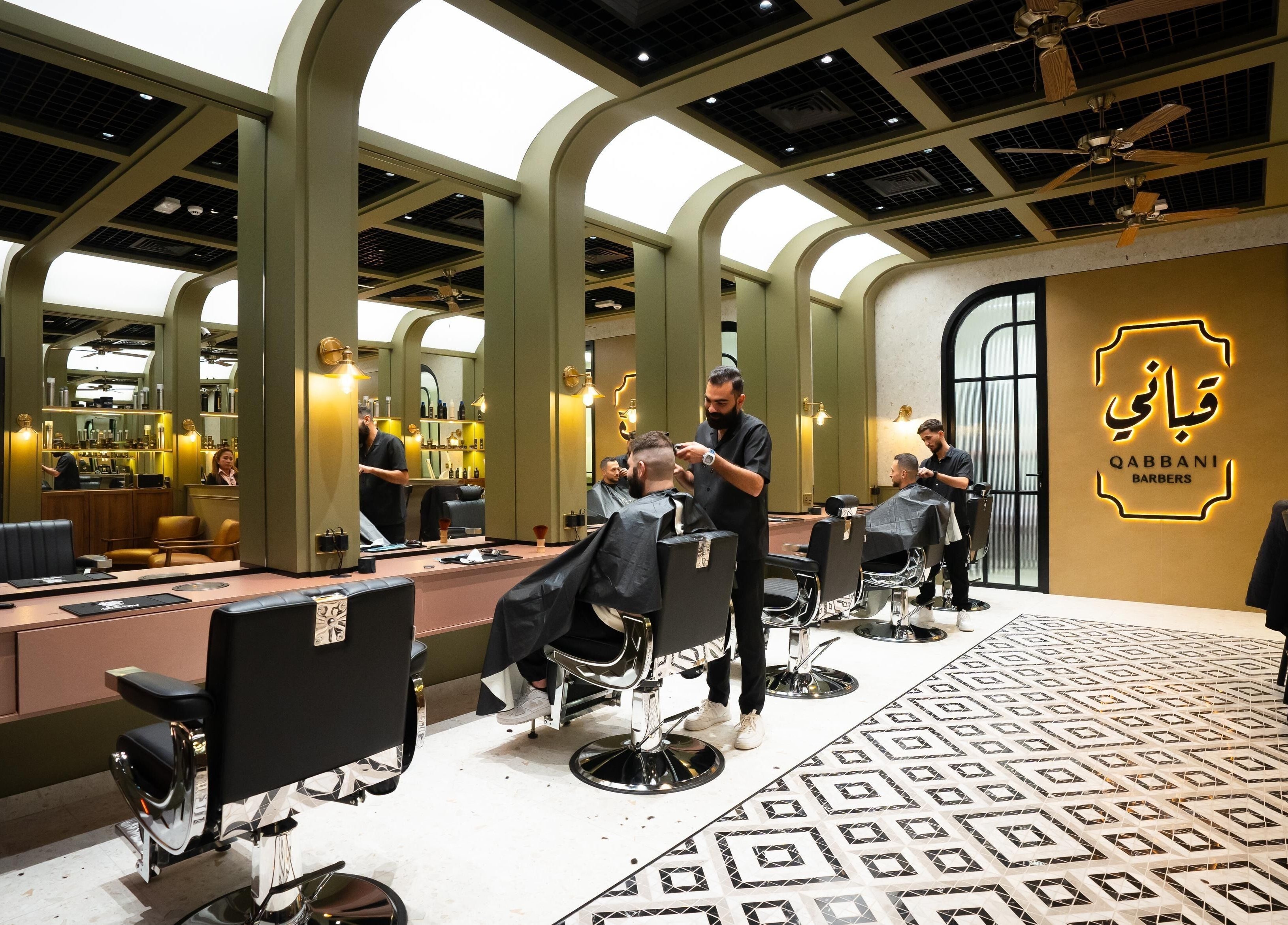 Qabbani Barbers elegant interior with stylists at work, located in Dubai, Dubai, AE.