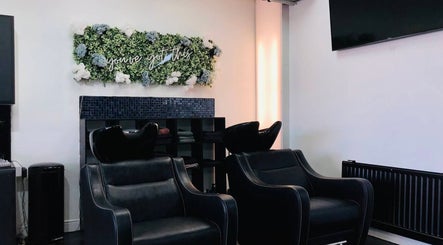 Sleek wash stations at Strands of Perfection, Telford, England, GB, enhance a modern salon vibe.