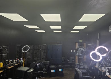 Modern interior of MAUI BARBERS ROTORUA in Rotorua, Bay Of Plenty, NZ with sleek chairs and bright lighting.