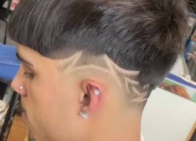 Close-up of a stylish buzz cut with design at MAUI BARBERS ROTORUA, Rotorua, Bay Of Plenty, NZ.