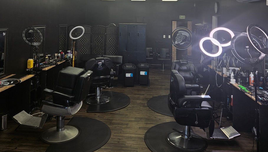 Interior of Maui Barbers Rotorua with sleek barber chairs, vibrant lighting in Rotorua, Bay Of Plenty, NZ.
