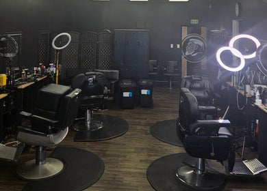 Interior of Maui Barbers Rotorua with sleek barber chairs, vibrant lighting in Rotorua, Bay Of Plenty, NZ.