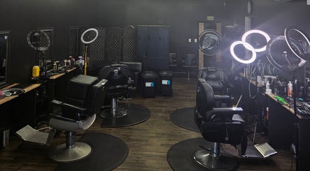 Interior of Maui Barbers Rotorua with sleek barber chairs, vibrant lighting in Rotorua, Bay Of Plenty, NZ.
