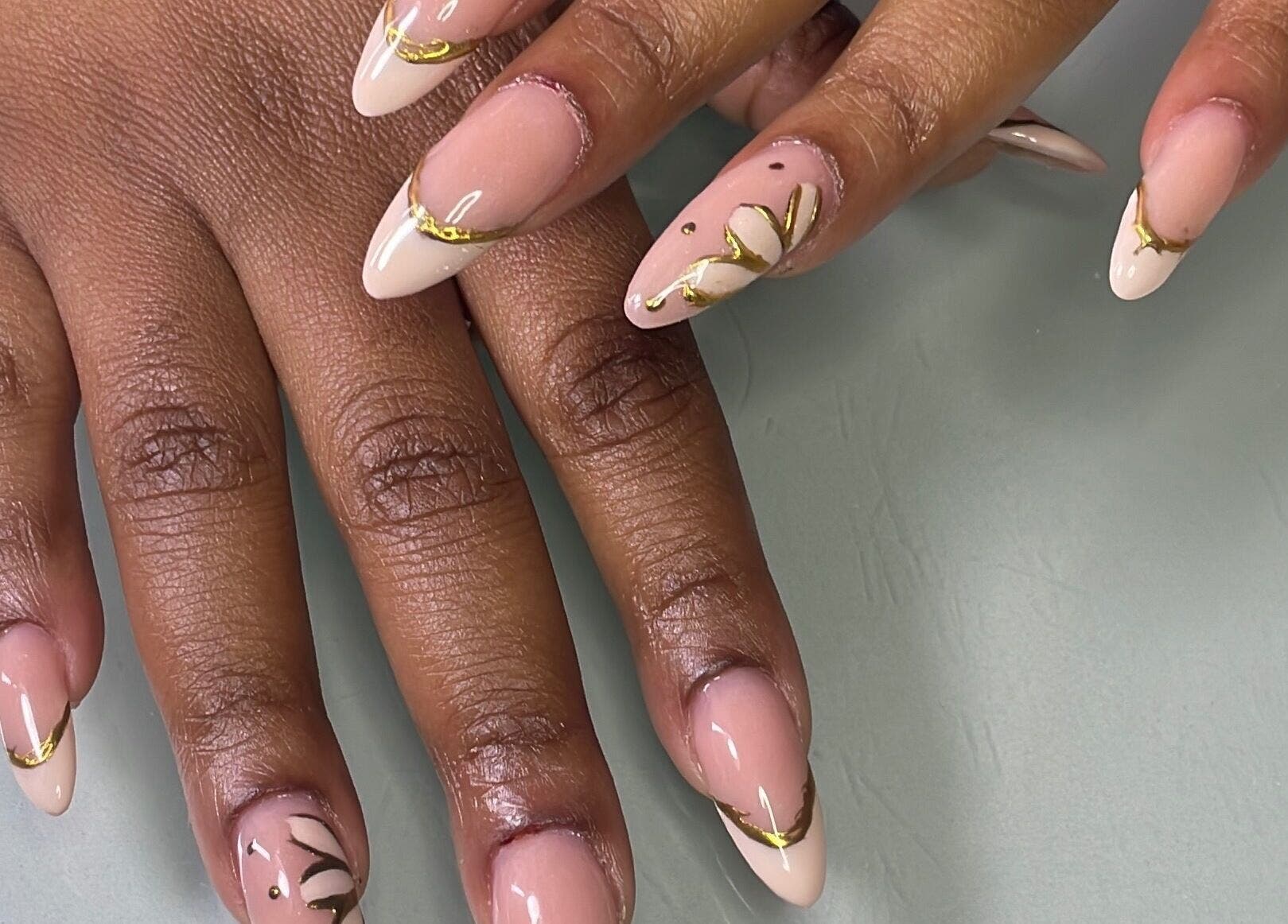 Elegant nail art with gold accents at Define Artistry Nail Bar, Gqeberha, Eastern Cape, ZA.