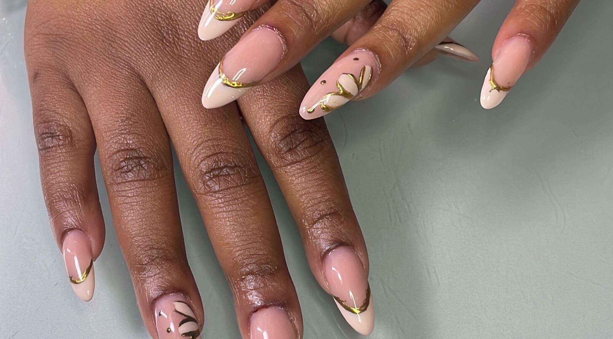Elegant nail art with gold accents at Define Artistry Nail Bar, Gqeberha, Eastern Cape, ZA.