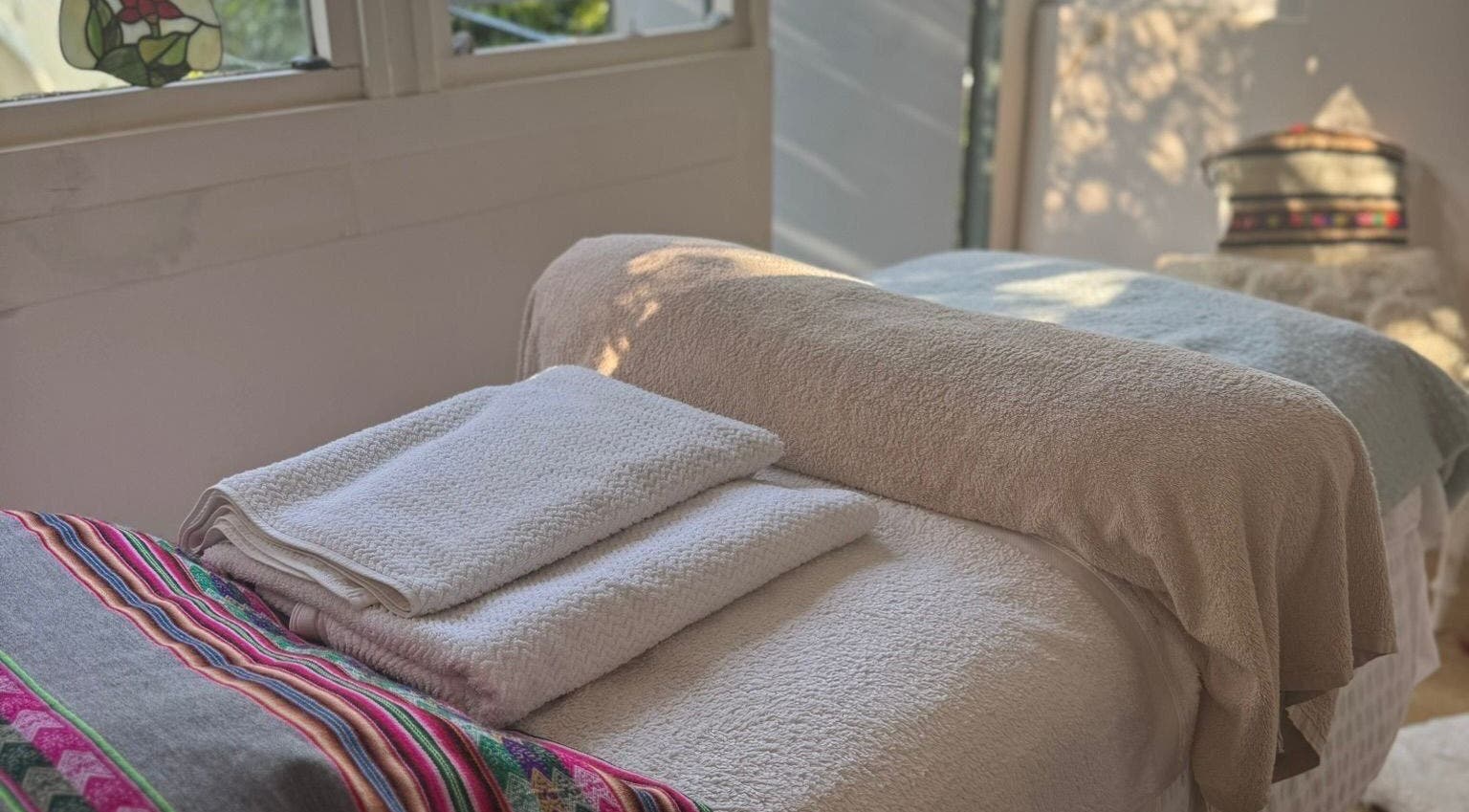 Peaceful massage room with towels at Rosie Atherton Wellbeing, Constantine, England, GB.