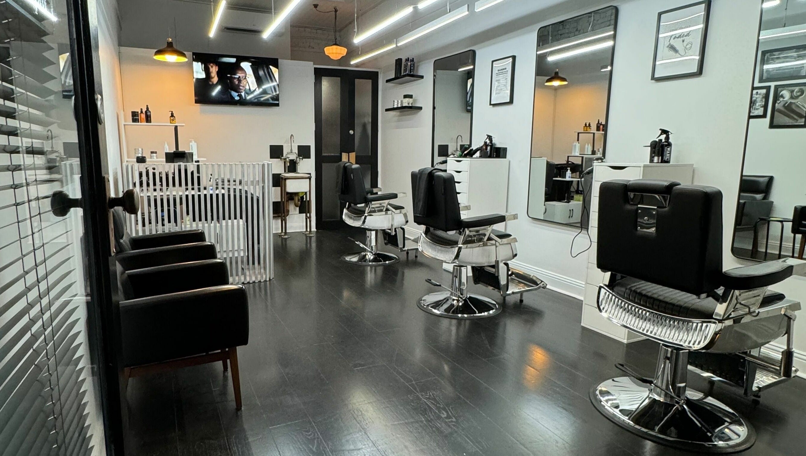 Interior view of Sleek Back salon in Melbourne, Victoria, AU showcasing stylish barber chairs and sleek decor.