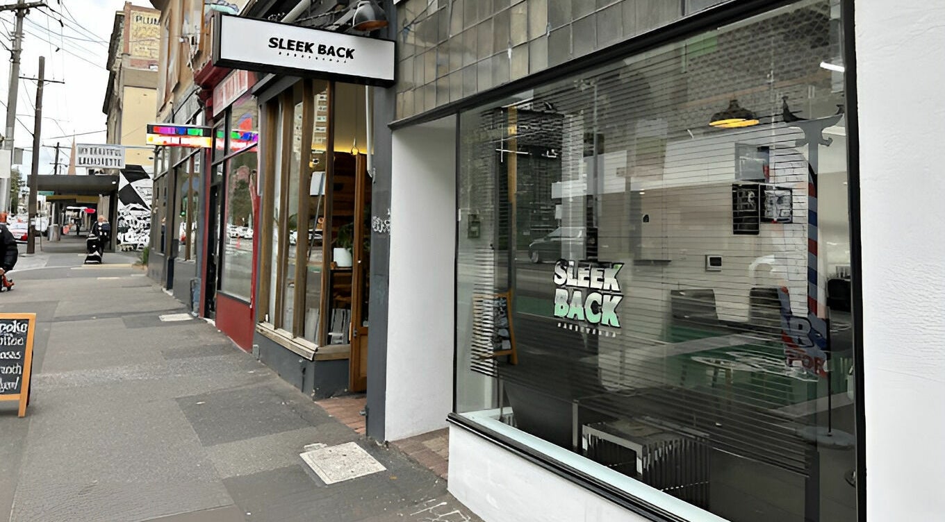 Exterior view of Sleek Back at Melbourne, Victoria, AU showcasing modern salon design.