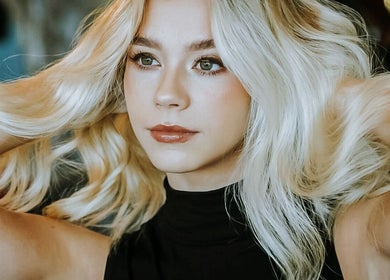 Blonde woman with styled hair at Steadman & Co, Peterborough, England, GB.