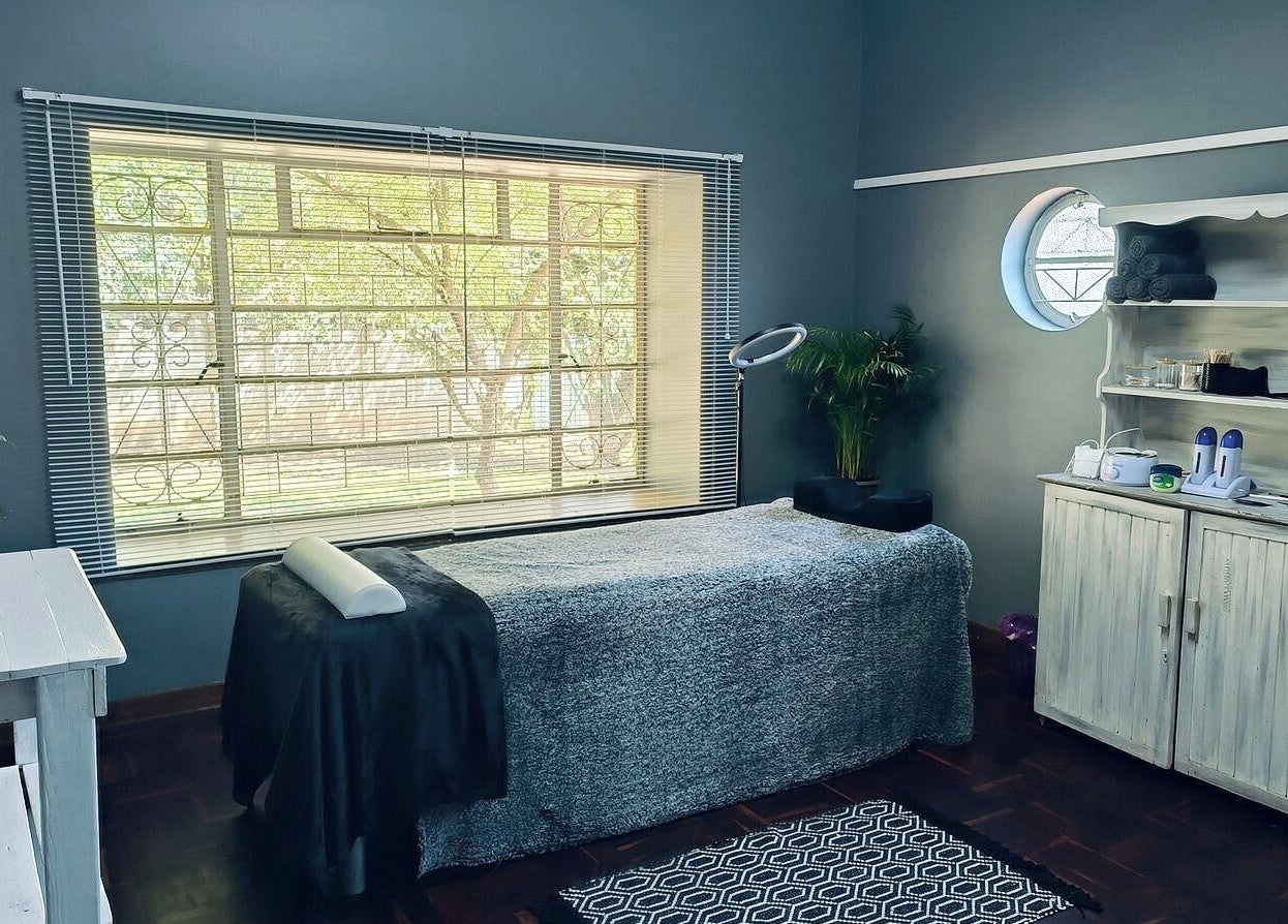 Calming spa space at Revive Hair Studio, Rustenburg, North West, ZA, featuring cozy massage table and serene decor.