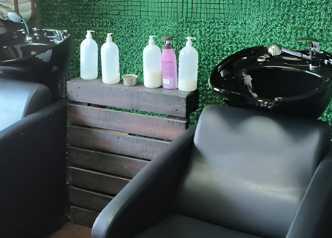 Modern washbasins at Revive Hair Studio, Rustenburg, North West, ZA, offering premium hair care services.
