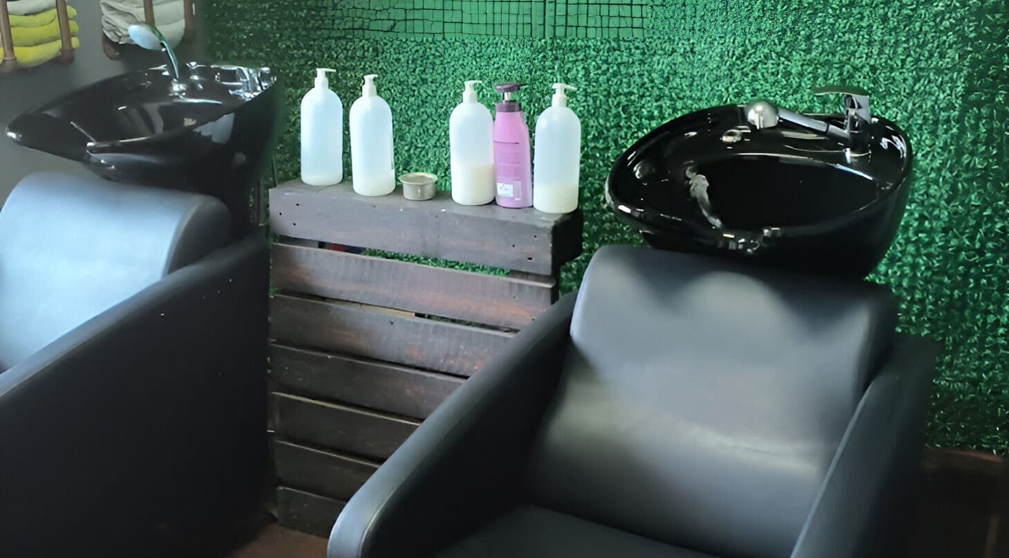 Modern washbasins at Revive Hair Studio, Rustenburg, North West, ZA, offering premium hair care services.