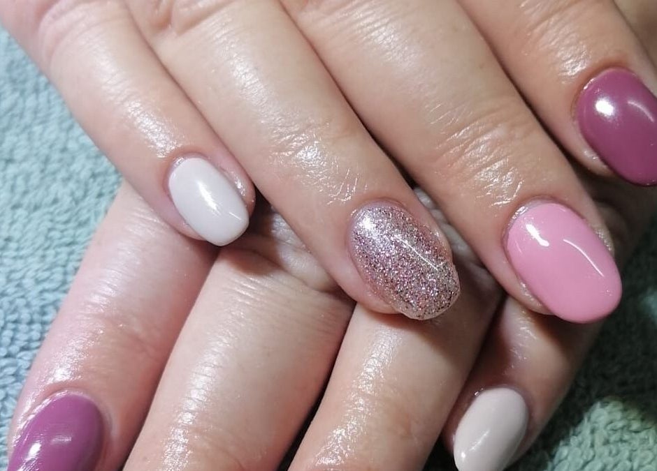 Stylish manicured nails with glitter at Revive Hair Studio, Rustenburg, North West, ZA.