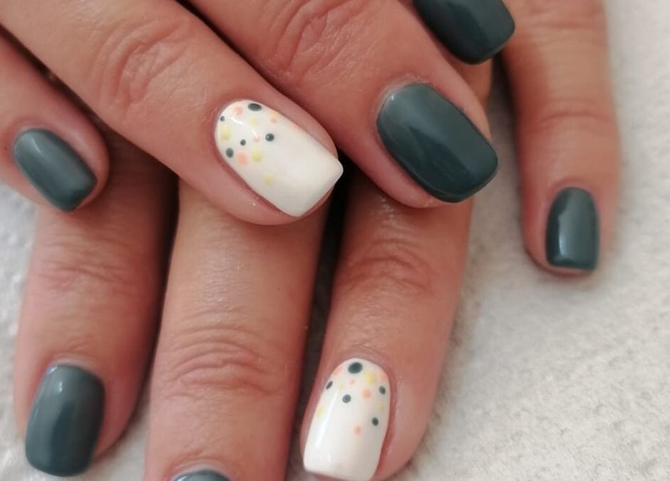 Stylish nail art in dark teal and polka dots at Revive Hair Studio, Rustenburg, North West, ZA.