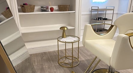 Elegant salon interior featuring chic furniture at Luxelooks, Porthcawl, Wales, GB.