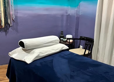 Relaxing massage room at Elysion Therapies, Carapo, Tunapuna/piarco Regional Corporation, TT, with soft lighting and soothing decor.