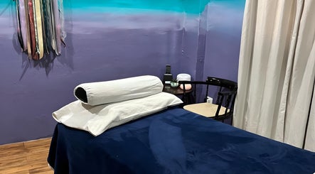 Relaxing massage room at Elysion Therapies, Carapo, Tunapuna/piarco Regional Corporation, TT, with soft lighting and soothing decor.