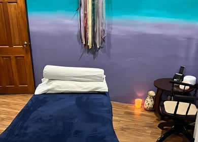 Serene massage room at Elysion Therapies, Carapo, Tunapuna/Piarco, TT featuring calming decor and ambient lighting.
