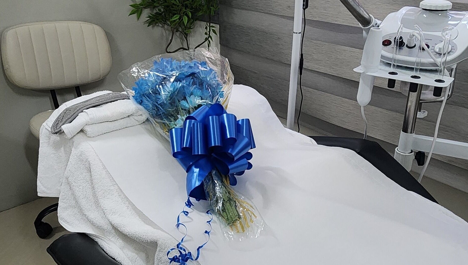 Zen Eden Lounge and Spa in Montego Bay, St. James Parish, JM. Treatment table adorned with blue flowers.
