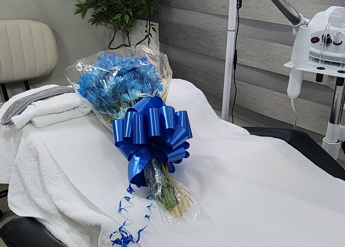 Zen Eden Lounge and Spa in Montego Bay, St. James Parish, JM. Treatment table adorned with blue flowers.