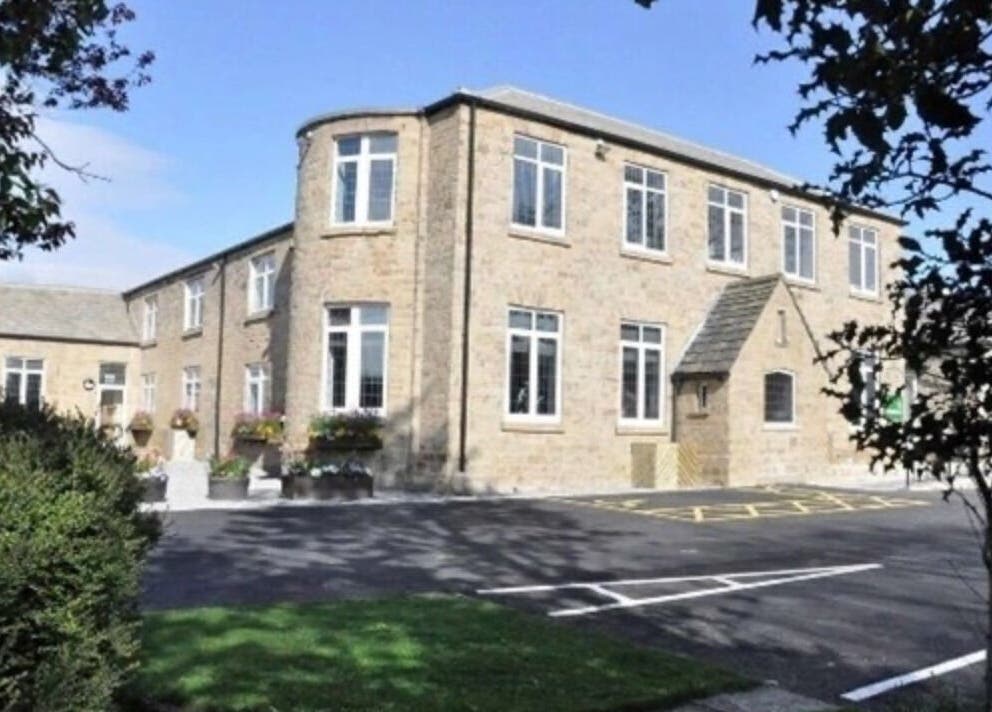 Scenic view of Inner Shine healing at Iveridge Hall, Oulton, England, GB, showcasing its elegant brick facade.