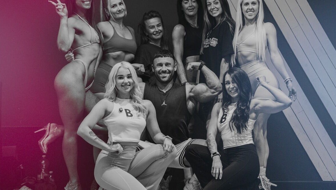 Group of people striking confident poses at Be Better Posing Coaching, Coventry, England, GB.