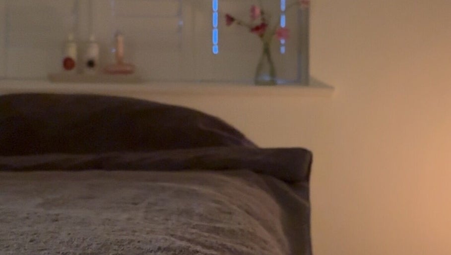 Calm massage room with dim lighting at Rosie Holland Holistic Massage in Shipston-on-Stour, England, GB.