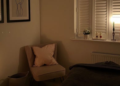 Serene massage room at Rosie Holland Holistic Massage, Shipston-on-Stour, England, with soft lighting and elegant decor.