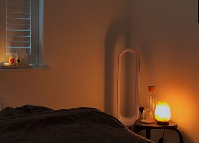 Cozy massage room at Rosie Holland Holistic Massage, Shipston-on-Stour, England, GB, with warm lighting.