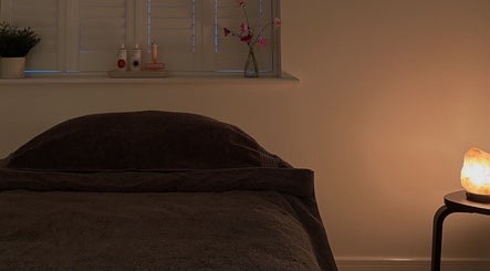 Relaxing massage room at Rosie Holland Holistic Massage, Shipston-on-stour, England, with salt lamp and cozy bedding.